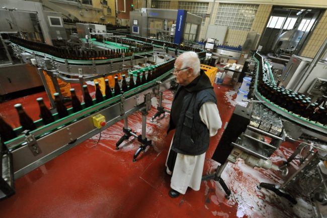A trappist monk oversees the bottling of Trappistes Rochefort beer A trappist monk oversees the bottling of Trappistes Rochefort beer
